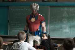 Peacemaker talking to a classroom of children